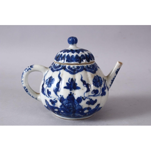 79 - A 19TH / 20TH CENTURY CHINESE BLUE & WHITE PORCELAIN TEAPOT, decorated with f lotus display, and flo... 