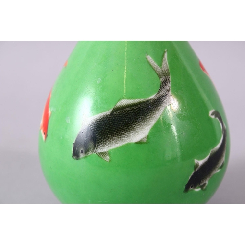 8 - A CHINESE GREEN GLAZED VASE, painted with fish, mark in red, 15cm high.