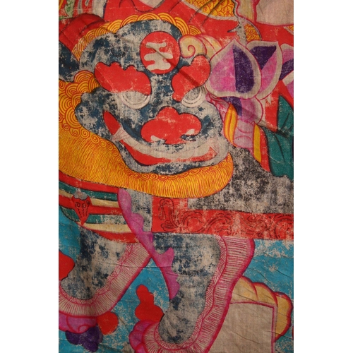 83 - A LARGE CHINESE PAINTED TEXTILE THANGKA, painted with scenes of a seated goddess with attendant, ver... 