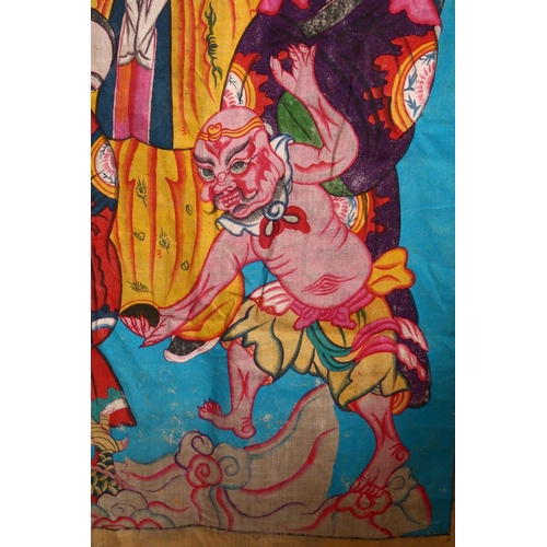 84 - A LARGE CHINESE PAINTED TEXTILE THANGKA, painted with scenes of dragons & Immortal figures, the vers... 