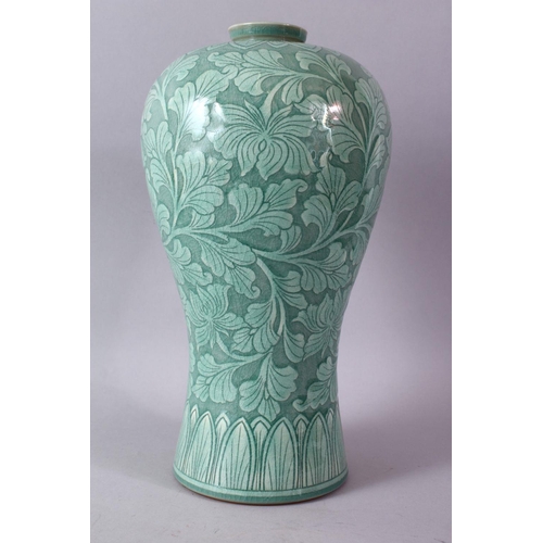 9 - A LARGE KOREAN CELEDON VASE, the body with srolling foliage, signed, 38cm high.