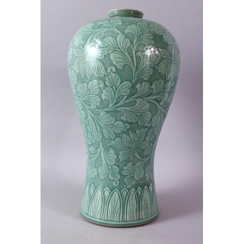 9 - A LARGE KOREAN CELEDON VASE, the body with srolling foliage, signed, 38cm high.