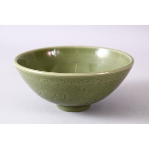 96 - A 19TH/20TH CENTURY CHINESE CARVED LONGQUAN CELEDON BOWL, with carved stylised floral decoration, 16... 