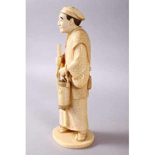 164E - A JAPANESE MEIJI PERIOD CARVED IVORY OKIMONO - MAN, stood in traditional dress, holding his staff an... 