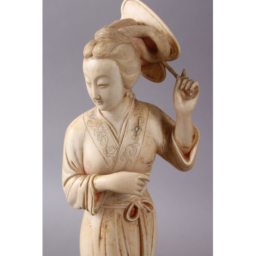 164G - A JAPANESE MEIJI PERIOD CARVED IVORY OKIMONO OF A GEISHA GIRL & FAN, stood holding an uchiwa fan alo... 