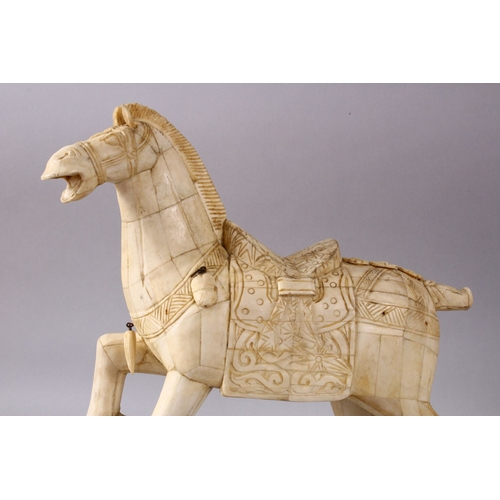 164I - A LARGE 19TH / 20TH CENTURY CHINESE CARVED SECTIONAL BONE FIGURE OF A TANG STYLE HORSE, stood in a s... 