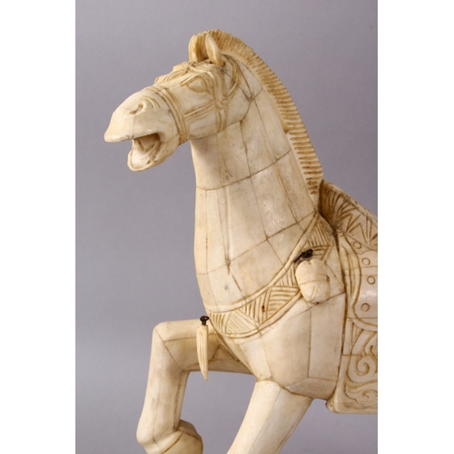 164I - A LARGE 19TH / 20TH CENTURY CHINESE CARVED SECTIONAL BONE FIGURE OF A TANG STYLE HORSE, stood in a s... 