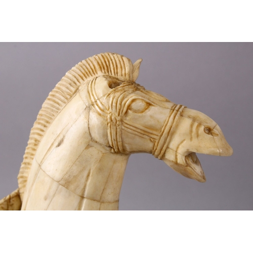 164I - A LARGE 19TH / 20TH CENTURY CHINESE CARVED SECTIONAL BONE FIGURE OF A TANG STYLE HORSE, stood in a s... 