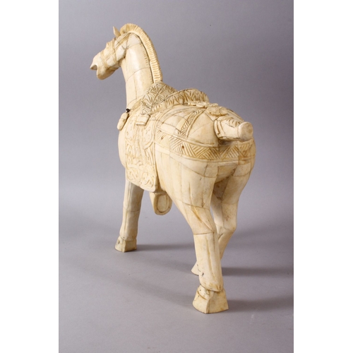 164I - A LARGE 19TH / 20TH CENTURY CHINESE CARVED SECTIONAL BONE FIGURE OF A TANG STYLE HORSE, stood in a s... 