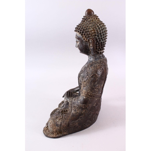 1 - A GOOD CHINESE BRONZE FIGURE OF SEATED BUDDHA, the body with raised decoration of dragons and styliz... 