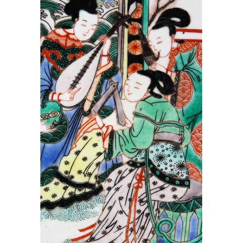 104 - A 20TH CENTURY CHINESE FAMILLE VERTE PORCELAIN DISH, painted with figures playing musical instrument... 