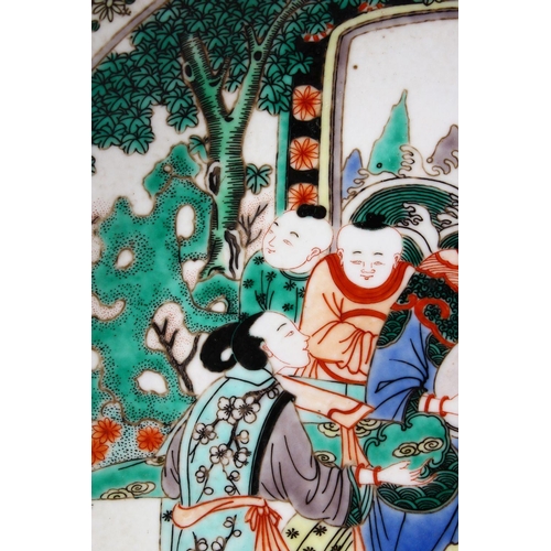 104 - A 20TH CENTURY CHINESE FAMILLE VERTE PORCELAIN DISH, painted with figures playing musical instrument... 