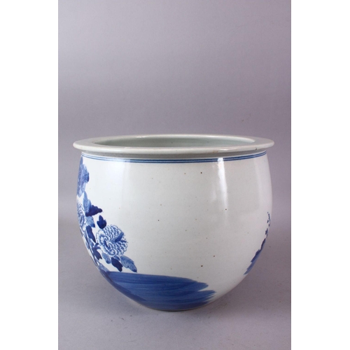 109 - A CHINESE BLUE AND WHITE JARDINIERE, painted with birds amongst native flora, 23cm high, 28cm diamet... 