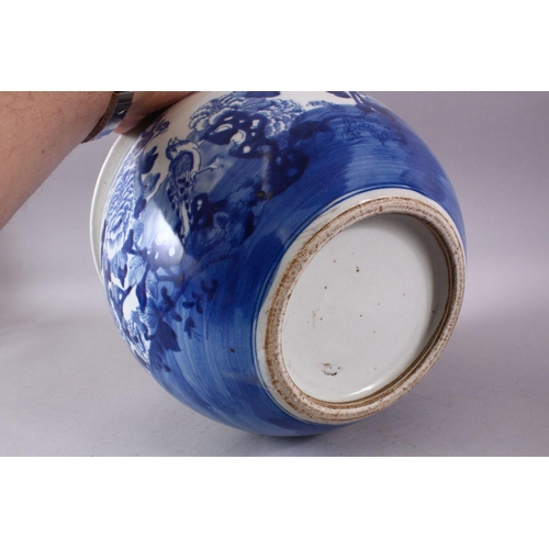 109 - A CHINESE BLUE AND WHITE JARDINIERE, painted with birds amongst native flora, 23cm high, 28cm diamet... 