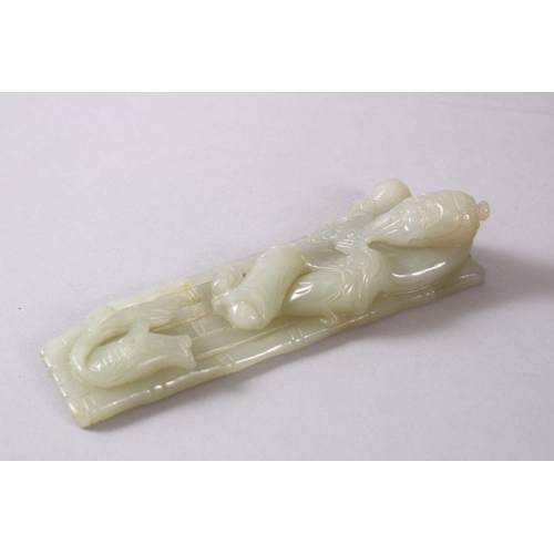 71 - A CHINESE CARVED CELADON JADE FIGURE OF A RECLINED IMMORTAL & FISH, the immortal figure reclined upo... 