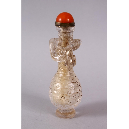 72 - A CHINESE ROCK CRYSTAL STYLE PEKING GLASS CARVED SNUFF BOTTLE, carved with archaic style with a moul... 