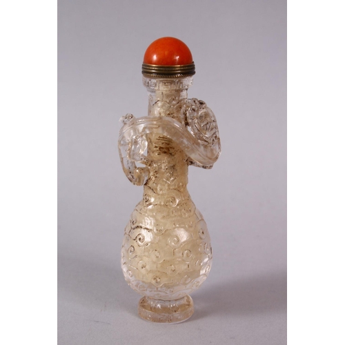 72 - A CHINESE ROCK CRYSTAL STYLE PEKING GLASS CARVED SNUFF BOTTLE, carved with archaic style with a moul... 