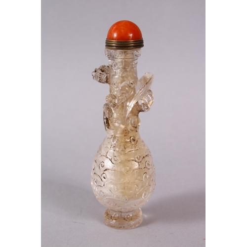 72 - A CHINESE ROCK CRYSTAL STYLE PEKING GLASS CARVED SNUFF BOTTLE, carved with archaic style with a moul... 