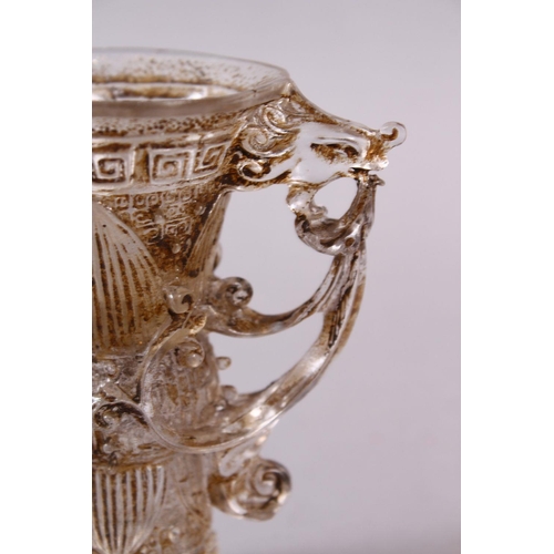 73 - A CHINESE ROCK CRYSTAL STYLE PEKING GLASS CARVED CUP, carved with archaic style, with a best emergin... 