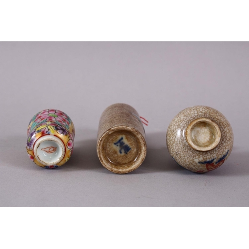 76 - THREE CHINESE PORCELAIN SNUFF BOTTLES, one of floral design, the other two with underglaze blue deco... 