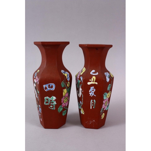 77 - A PAIR OF CHINESE ENAMEL YIXING CLAY HEXAGONAL VASES, the body with display of flora and calligraphy... 