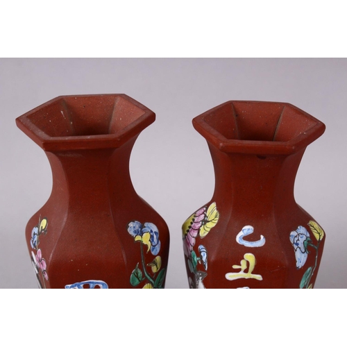77 - A PAIR OF CHINESE ENAMEL YIXING CLAY HEXAGONAL VASES, the body with display of flora and calligraphy... 