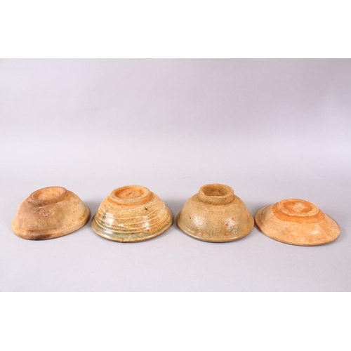 85 - FOUR EARLY CHINESE POTTERY BOWLS, 15.5cm down to 14.5cm
