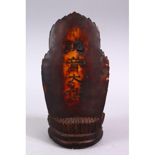 89 - A GOOD CHINESE CARVED IVORY STYLE FIGURE OF SEATED GUANYIN, seated upon a lotus base, with her hands... 