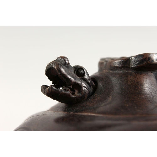 90 - A GOOD CHINESE YIXING CLAY DRAGON TEAPOT, the body of the pot with moulded dragon decoration, the fi... 