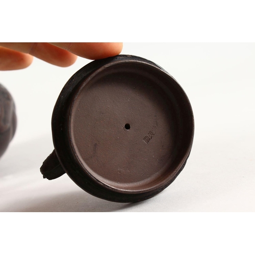 90 - A GOOD CHINESE YIXING CLAY DRAGON TEAPOT, the body of the pot with moulded dragon decoration, the fi... 