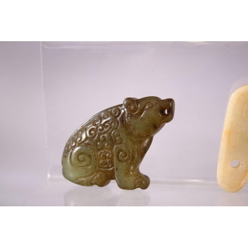 93 - A MIXED LOT OF EIGHT CARVED CHINESE JADE ITEMS, consisting of: A carved jade chilong belt hook, 9cm,... 