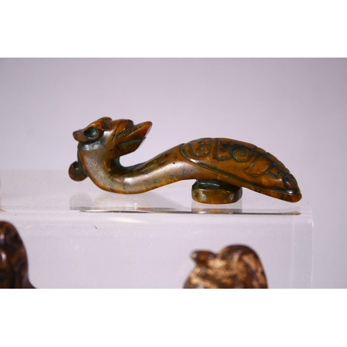 93 - A MIXED LOT OF EIGHT CARVED CHINESE JADE ITEMS, consisting of: A carved jade chilong belt hook, 9cm,... 