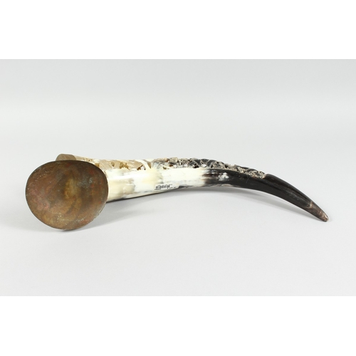 12 - A BOVINE HORN carved with elephants, 18 in. long.