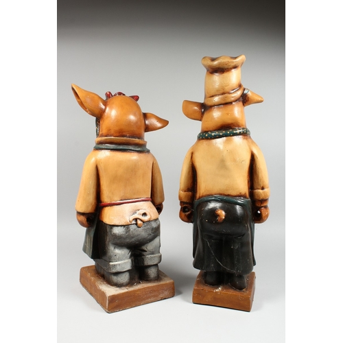 15 - A PAIR OF AMUSING POTTERY PIGS, 24 in. and 21 in. high.