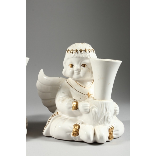 22 - A PAIR OF GILDED ANGEL SPILL VASES, 6 in. high.