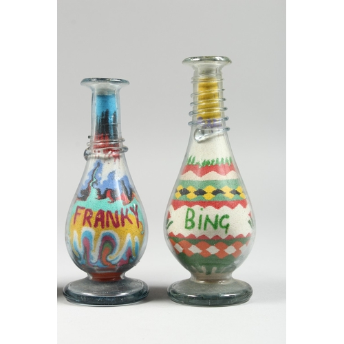 30 - A PAIR OF OVAL VASES painted with birds, 5.5 in. high and two glass sand vases,  5 in. high. (4)