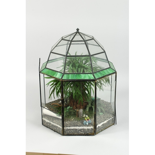 33 - A TERRARIUM  with plastic flowers 1 ft. 5 in. high