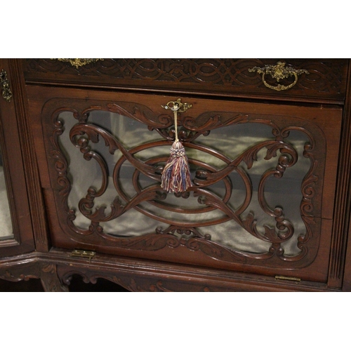 38 - A VICTORIAN MAHOGANY STANDING CHINA CABINET the top with three mirrored panels, on a base with bow f... 