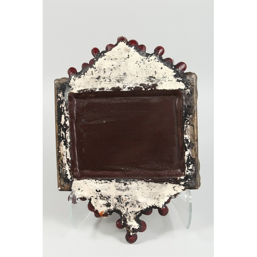 41 - A SMALL MIRROR with fruiting vines in a composition frame, 14 in. x 10 in.