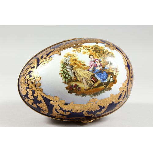 43 - A PORCELAIN BLUE AND GILDED EGG, 8 in.