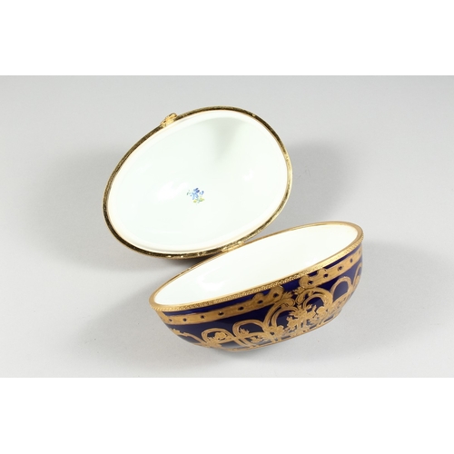 43 - A PORCELAIN BLUE AND GILDED EGG, 8 in.