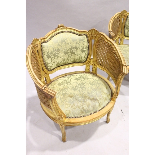 53 - A GOOD PAIR OF FRENCH GILDED BERGERE ARMCHAIRS WITH PADDED BACKS AND SEATS.