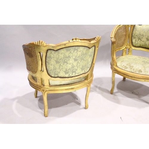 53 - A GOOD PAIR OF FRENCH GILDED BERGERE ARMCHAIRS WITH PADDED BACKS AND SEATS.