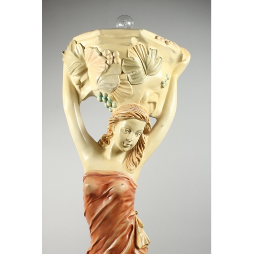 57 - A COMPOSITION CREAM AND GILDED UPLIGHTER formed as a classical female figure holding a basket, 4 ft.... 