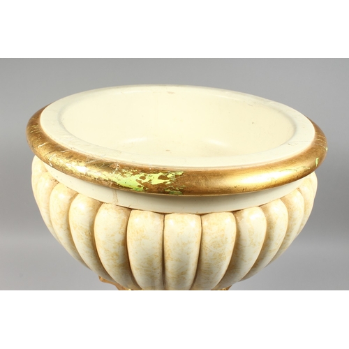 59 - A COMPOSITION CREAM AND GILDED JARDINIERE on a circular base, 2 ft. high.