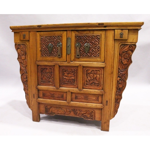 71 - A CHINESE ALTAR TABLE with plain top carved front cupboard doors and drawers, 3 ft. 7 in. long, 1 ft... 