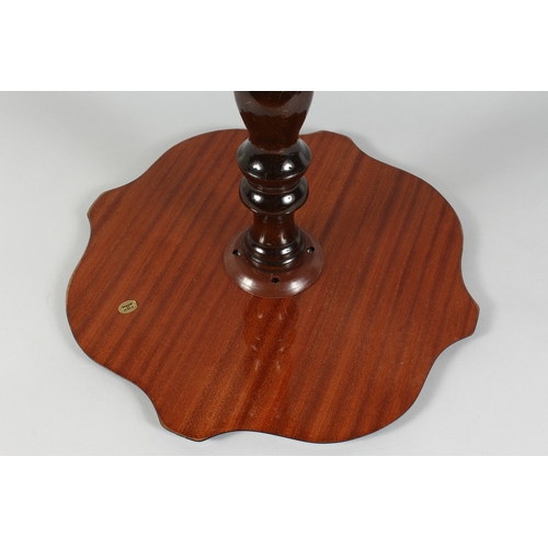 73 - A FLORAL INLAID SHAPED TOP TRIPOD TABLE (ITALIAN) on curving legs, 2 ft. high.