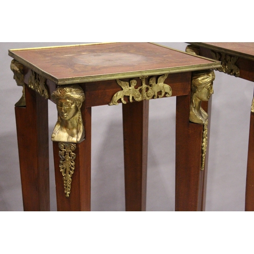 75 - A SET OF THREE SQUARE TOP TORCHERES  with mask mounts, tapering supports, undertier and gilt legs.  ... 