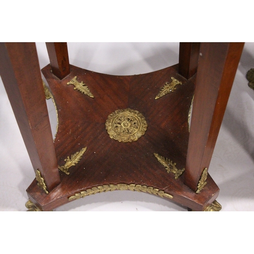 75 - A SET OF THREE SQUARE TOP TORCHERES  with mask mounts, tapering supports, undertier and gilt legs.  ... 