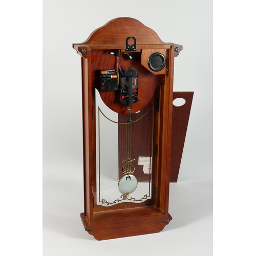 81 - A WESTMINSTER CHIME, LONDON CLOCK CO. HANGING CLOCK, 2 ft. 3 in. high.